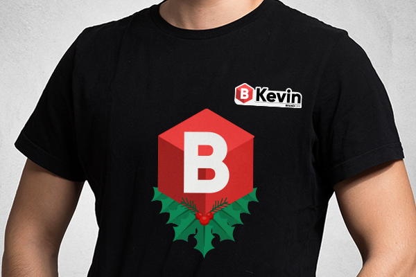 Holiday themed iron-on and badge on employee t-shirt